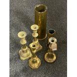 Two brass shells together with pair of brass candlesticks and two further brass candlesticks