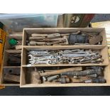 Two wooden trays containing a quantity of hand tools, ring spanners,