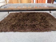 A contemporary brown rug