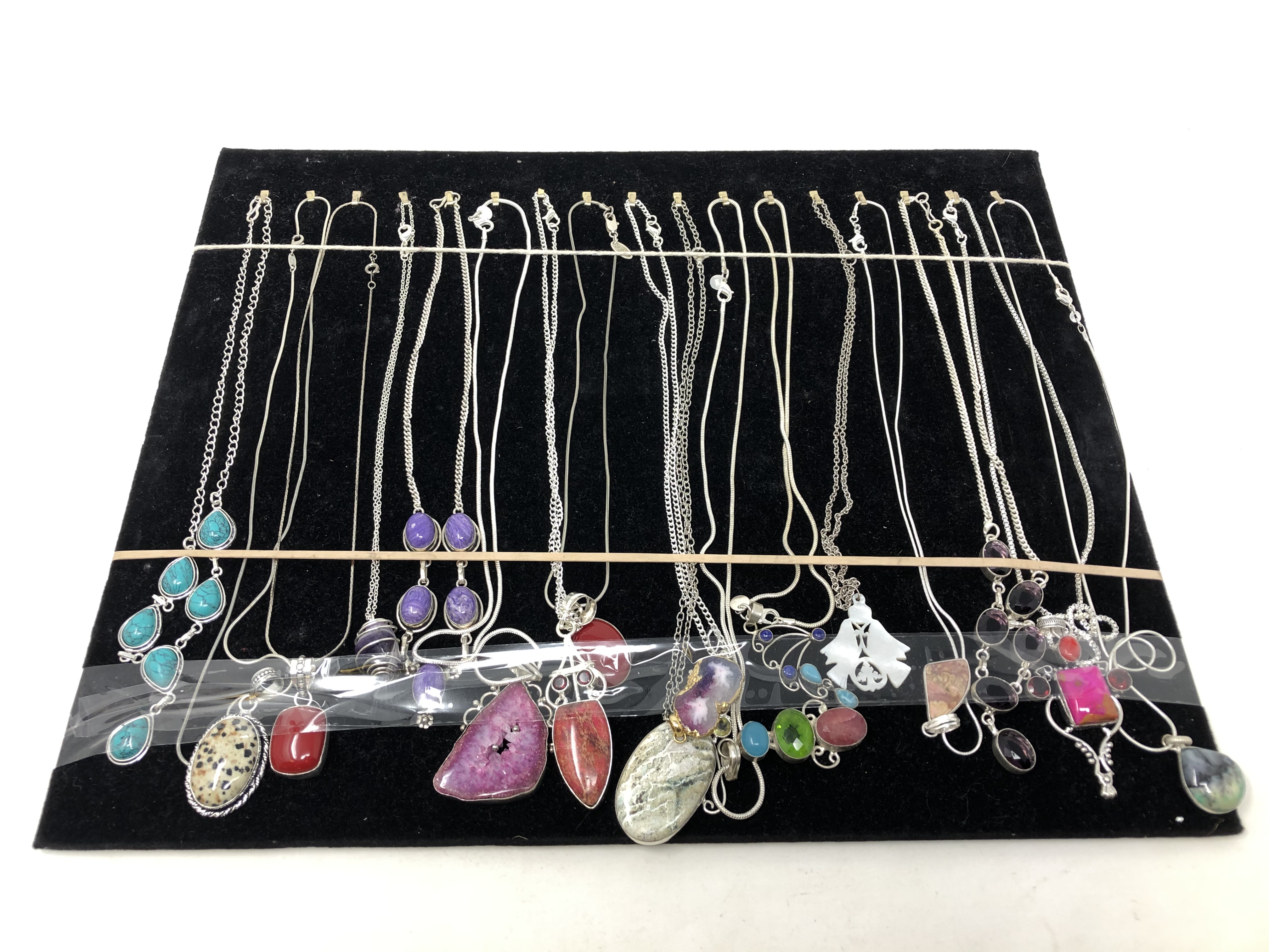 A collection of seventeen vintage style Sterling silver necklace and pendants