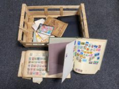 A box of assorted stamp albums and stamps,