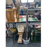 A collection of assorted fishing rods, landing net,