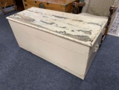 An antique painted pine blanket box