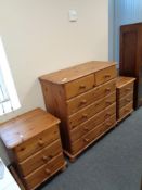 A contemporary pine six drawer chest together with a pair of three drawer bedside chests