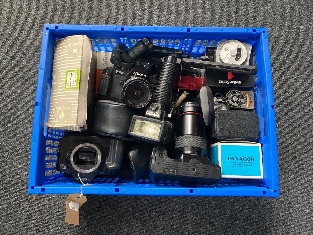 A crate of a quantity of assorted cameras and accessories