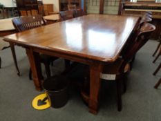 A heavy quality oak dining room table with under stretcher, 245 cm x 118 cm.