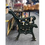 A pair of cast iron bench ends