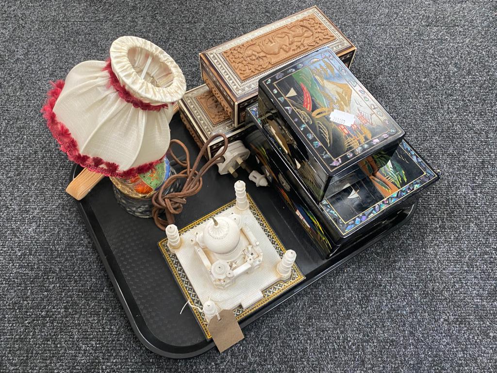 A tray of lacquered jewellery boxes, carved Indian table boxes, Japanese figural lamp, hand fans,