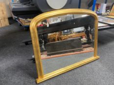 A gilt framed arch topped overmantel mirror