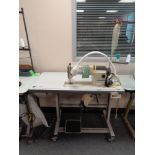 A Korean KM-235A industrial electric flat sewing machine in table