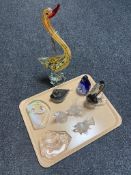 A tray of assorted glass ornaments, wolf and swan paperweights, penguin family,