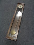 An oak cased English Clock Systems of London clocking in machine