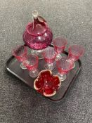 A cranberry glass lidded bowl, 1970's red glass ash tray,