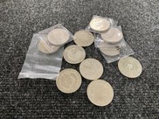 A bag containing ten £5 coins