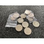 A bag containing ten £5 coins