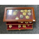 A pocket watch display case containing thirty assorted contemporary pocket and fob watches