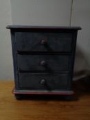 A painted Victorian style three drawer miniature chest
