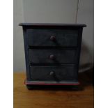 A painted Victorian style three drawer miniature chest