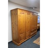 A Jaycee pine four door wardrobe fitted with two drawers