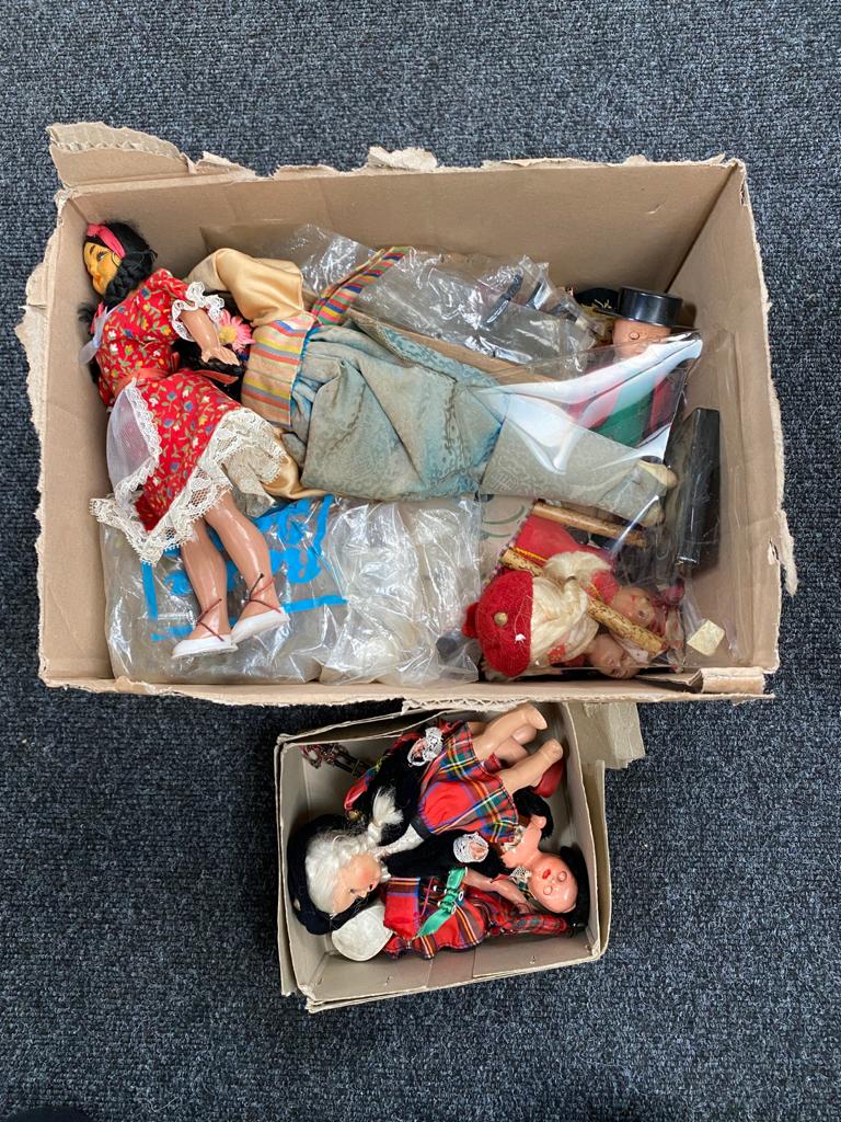 A box of vintage dolls,