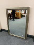 A silvered framed bevelled overmantel mirror