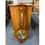 An early 20th century mahogany barometer with brass dial and presentation plaque