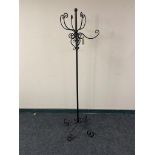 A metal hat and coat stand