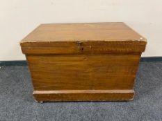 An antique pine blanket box