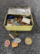 A tin of a collection of assorted badges including Freemasons,