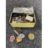 A tin of a collection of assorted badges including Freemasons,