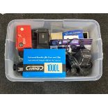 A clear plastic storage crate with lid containing cameras, Olympus OM1, digital camera, cine camera,