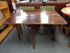 An early twentieth century mahogany flap sided table