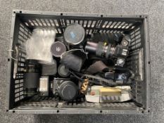 A crate of a quantity of assorted cameras and accessories