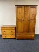 A five piece pine bedroom suite comprising of double wardrobe, five drawer chest,