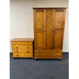 A five piece pine bedroom suite comprising of double wardrobe, five drawer chest,