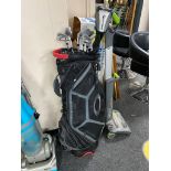 A golf bag containing seven Ping irons together with a Taylor Made driver