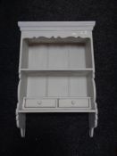 A painted pine kitchen wall rack fitted with two drawers