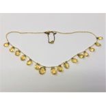 An antique citrine and pearl necklace with gold clasp
