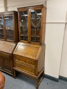 An Edwardian oak bureau bookcase CONDITION REPORT: 192cm high by 77cm wide by 46cm