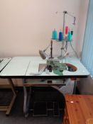 A Yamaha Industrial overlocking sewing machine in table