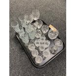 A tray of glass ware, crystal, hand bell,
