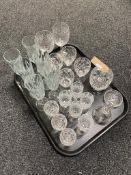 A tray of glass ware, crystal, hand bell,