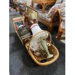 A wicker basket and wooden crate of crash helmet, rustic magazine rack, brass ware, table lamps,