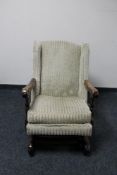 A mid century oak framed rocking chair