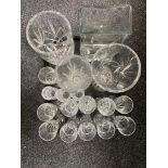 A tray of glass, wine glasses and vases,