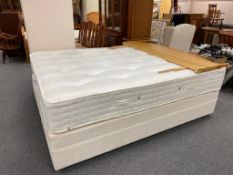 A 5' mattress on Dunlopilo base with pine headboard