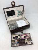 A jewellery box containing sterling silver and white metal jewellery