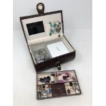 A jewellery box containing sterling silver and white metal jewellery