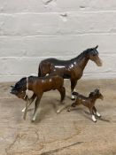 A Beswick horse in brown gloss (a/f) together with two further Beswick brown gloss ponies