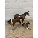 A Beswick horse in brown gloss (a/f) together with two further Beswick brown gloss ponies